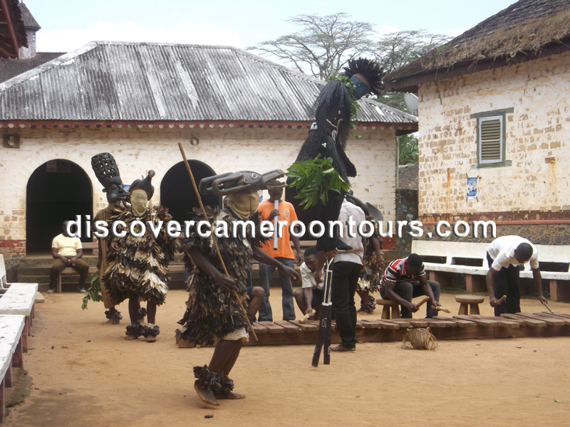 Traditional juju masked dancers at the Bafut palace